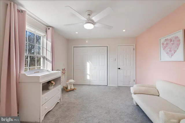 a living room with furniture and windows
