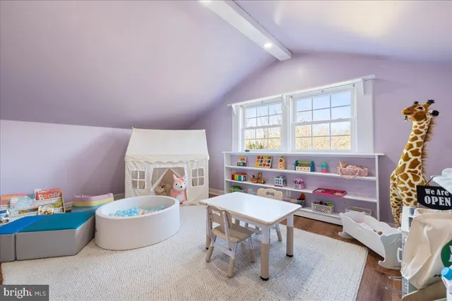 a living room with furniture a window and a table