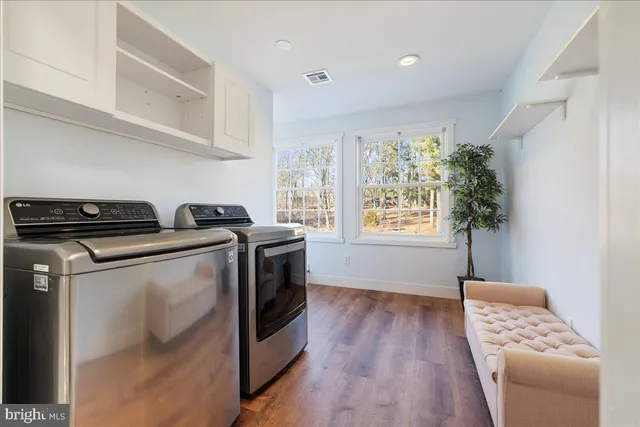 a view of kitchen with furniture wooden floor and window