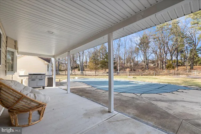 a view of swimming pool with outdoor seating