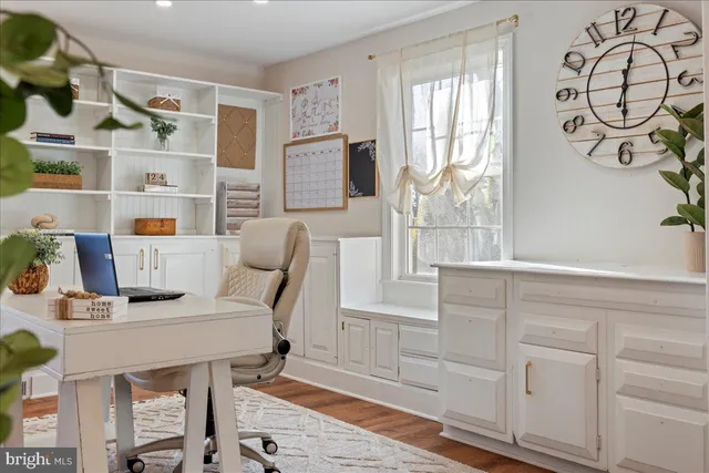 a workspace with furniture and window