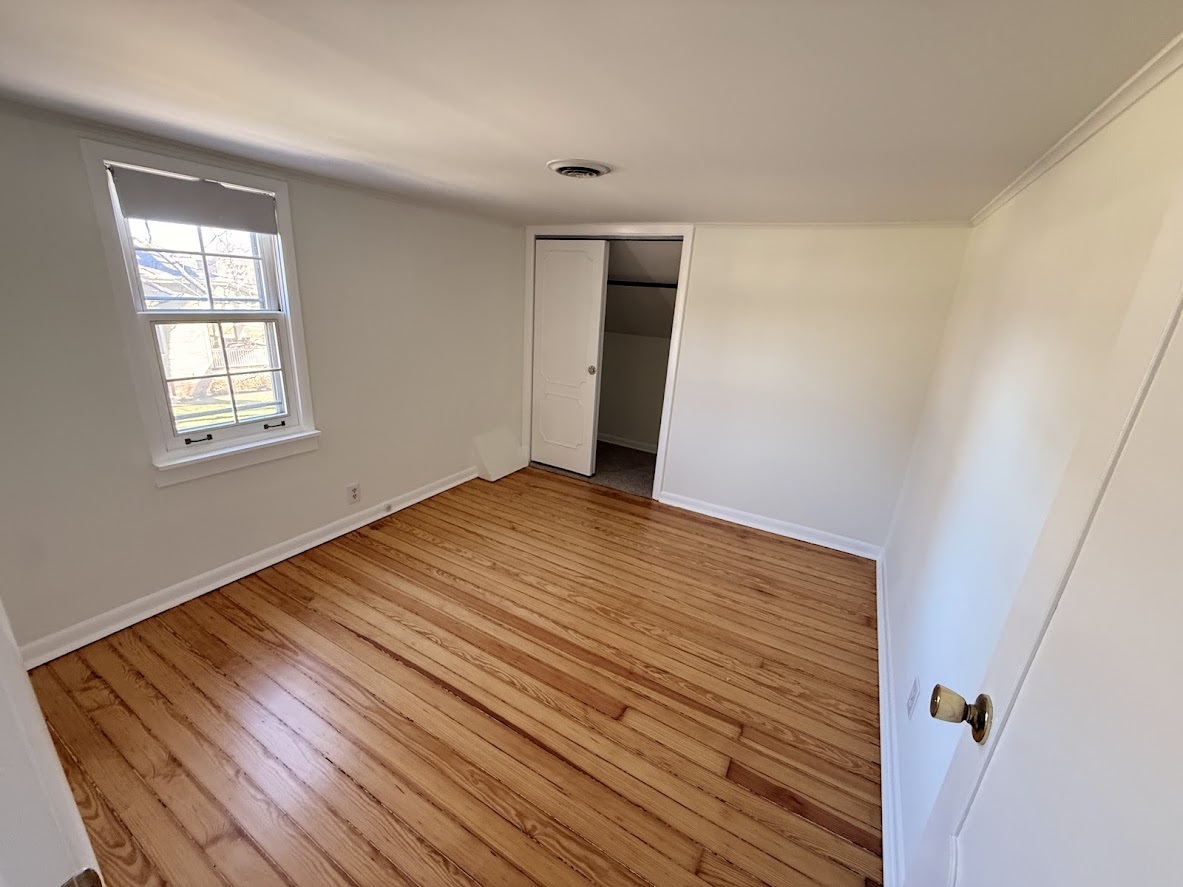 18404 Dixie Highway Homewood, IL 60430 - Photo 15 of 20 a view of an empty room with wooden floor and a window