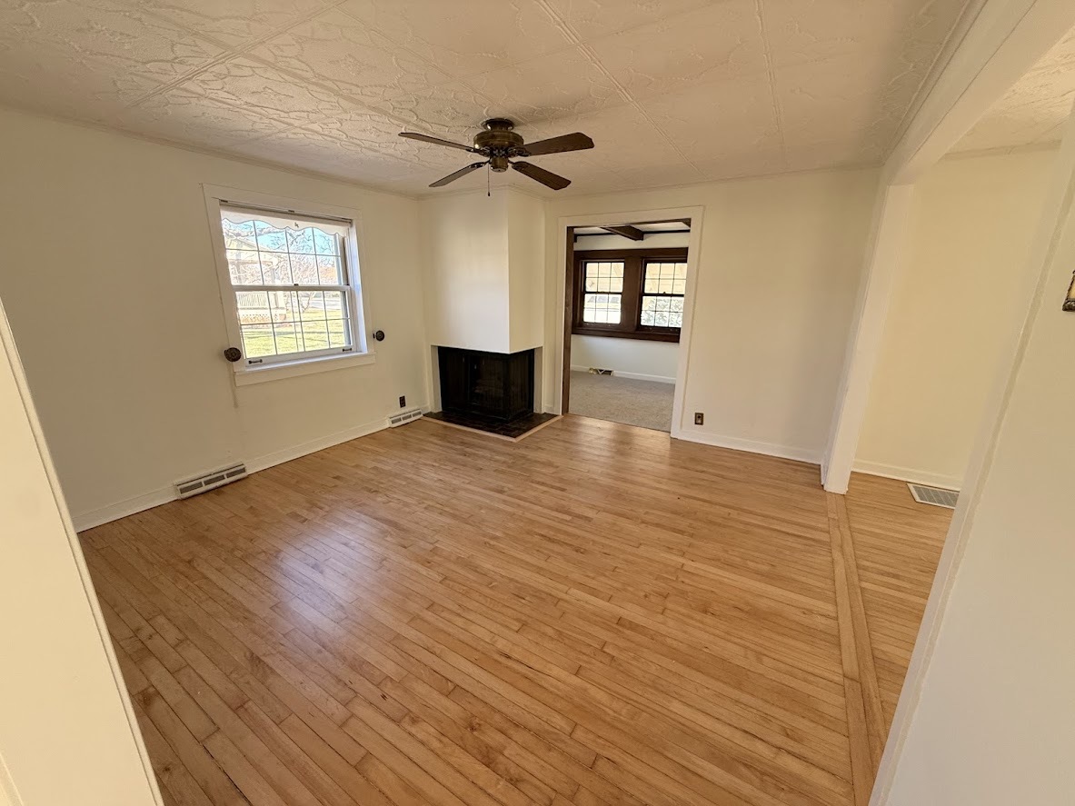 18404 Dixie Highway Homewood, IL 60430 - Photo 2 of 20 a view of empty room with wooden floor and fan