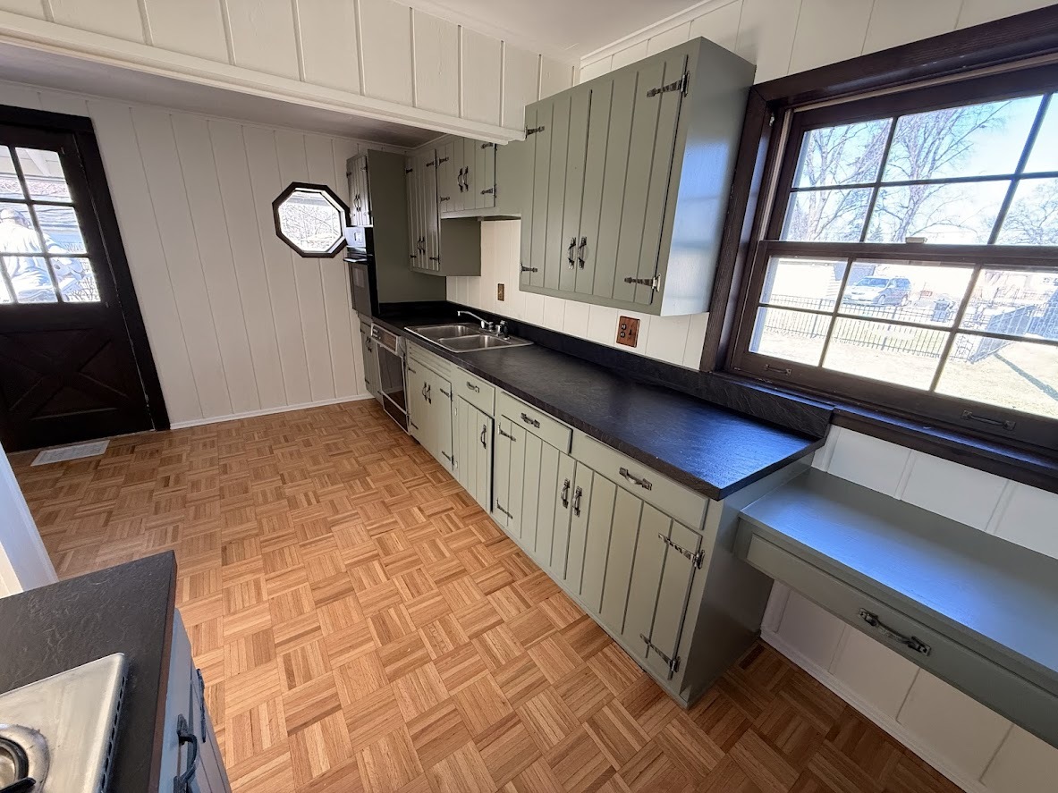 18404 Dixie Highway Homewood, IL 60430 - Photo 6 of 20 a kitchen with stainless steel appliances wooden cabinets and a large window