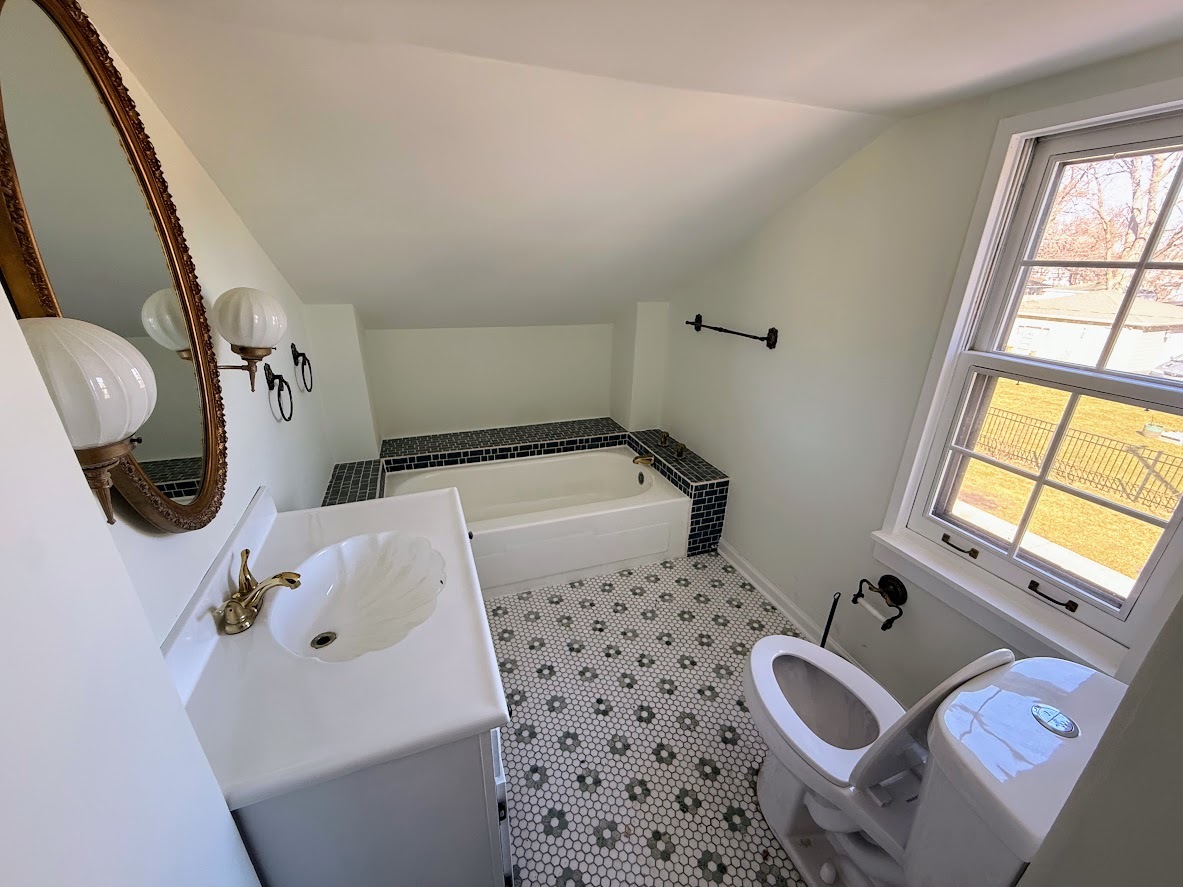 18404 Dixie Highway Homewood, IL 60430 - Photo 10 of 20 a bathroom with a sink and a mirror