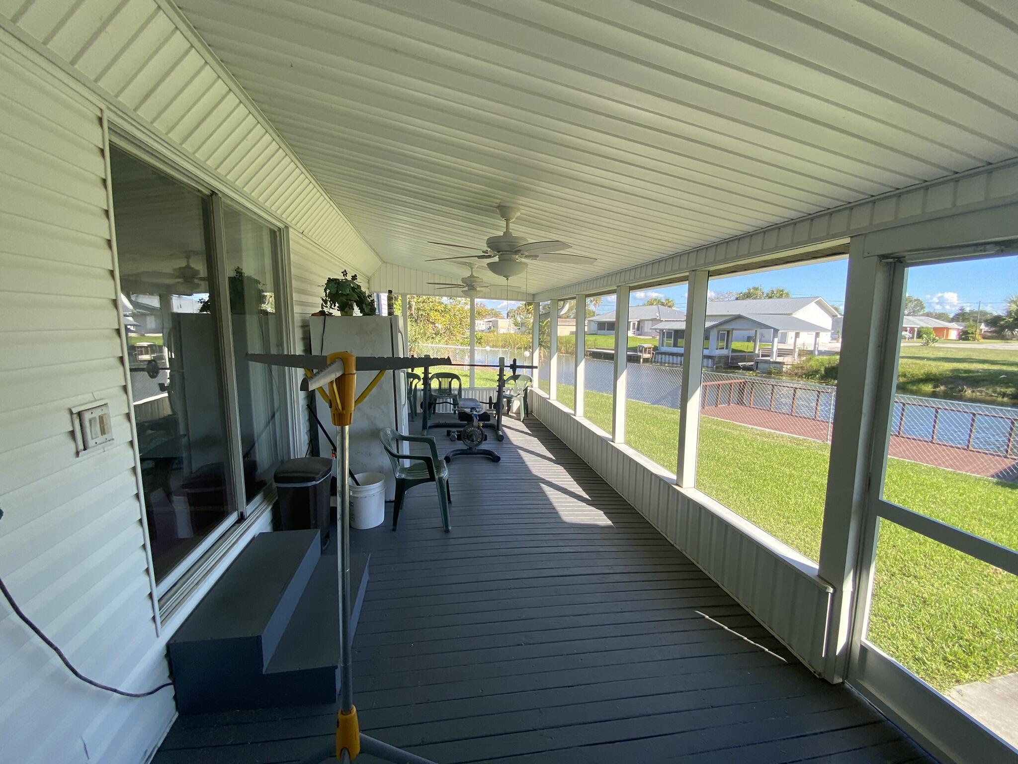 1101 25th Street Okeechobee, FL 34974 - Photo 16 of 28 an empty room with wooden floor