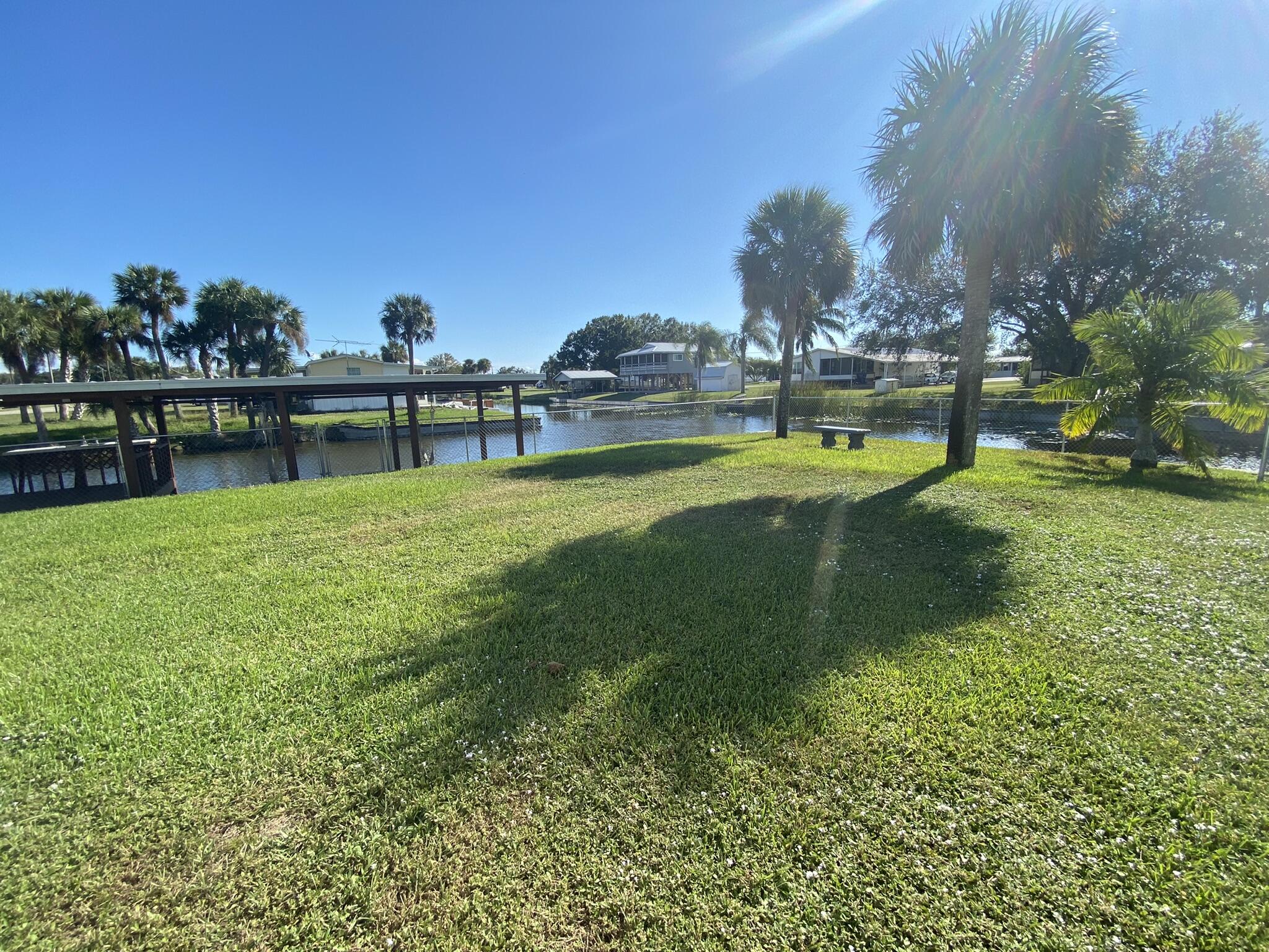 1101 25th Street Okeechobee, FL 34974 - Photo 17 of 28 a view of a lake with houses