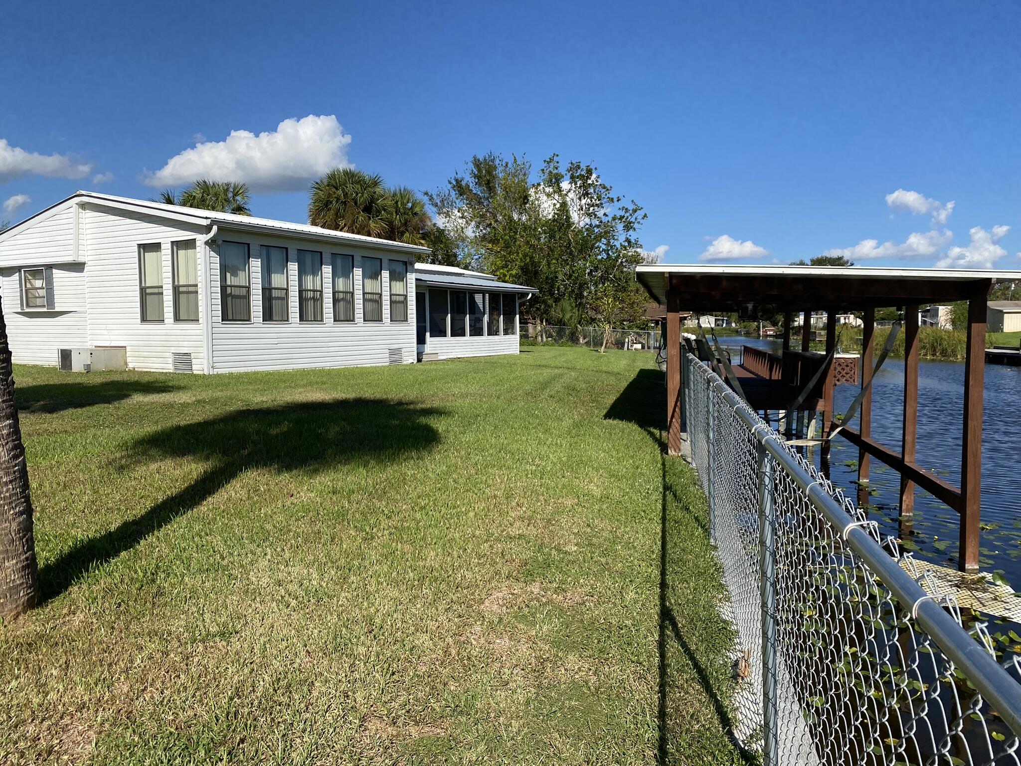 1101 25th Street Okeechobee, FL 34974 - Photo 20 of 28 a view of a house with backyard