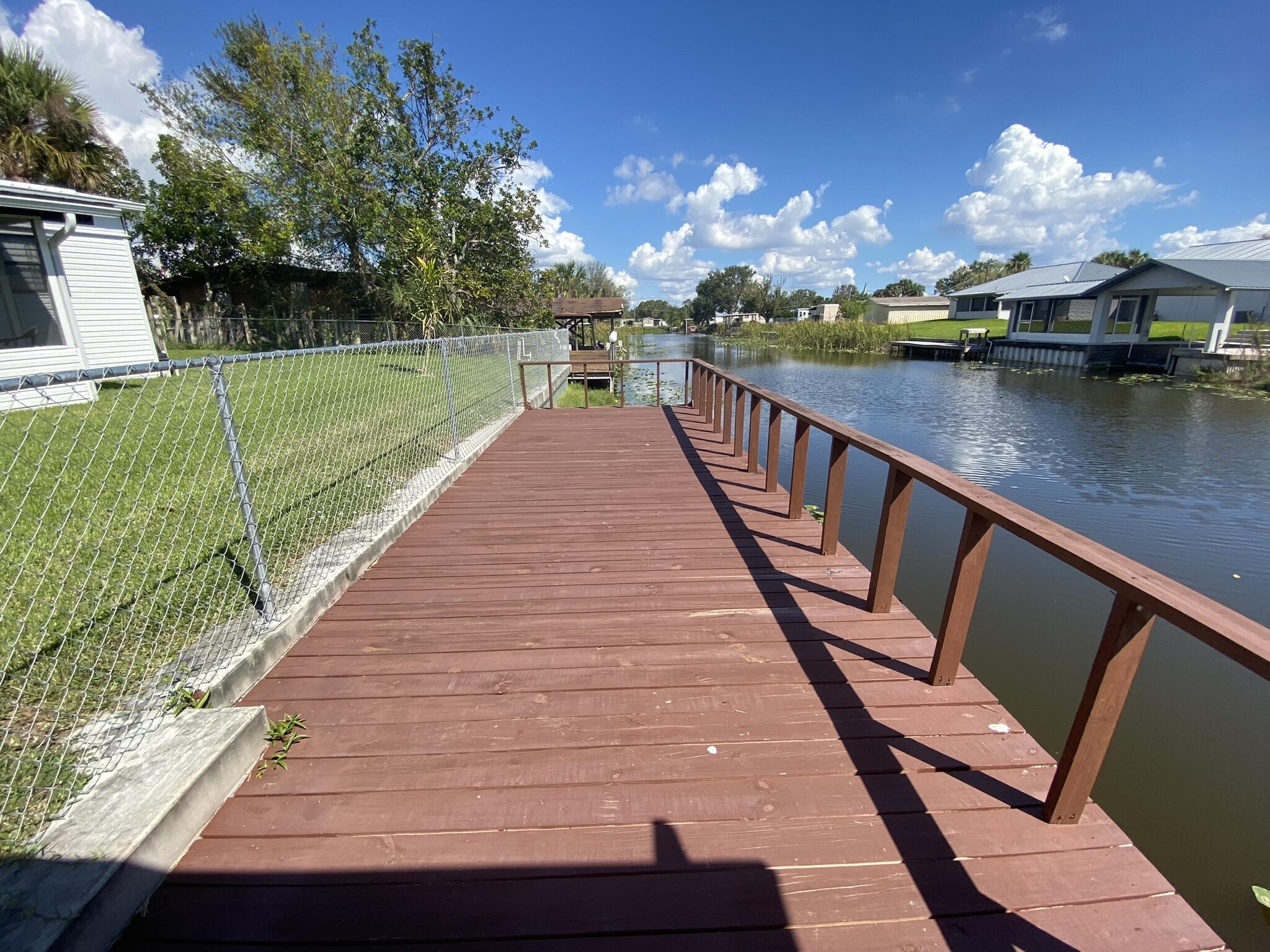 1101 25th Street Okeechobee, FL 34974 - Photo 2 of 28 a view of swimming pool from a balcony