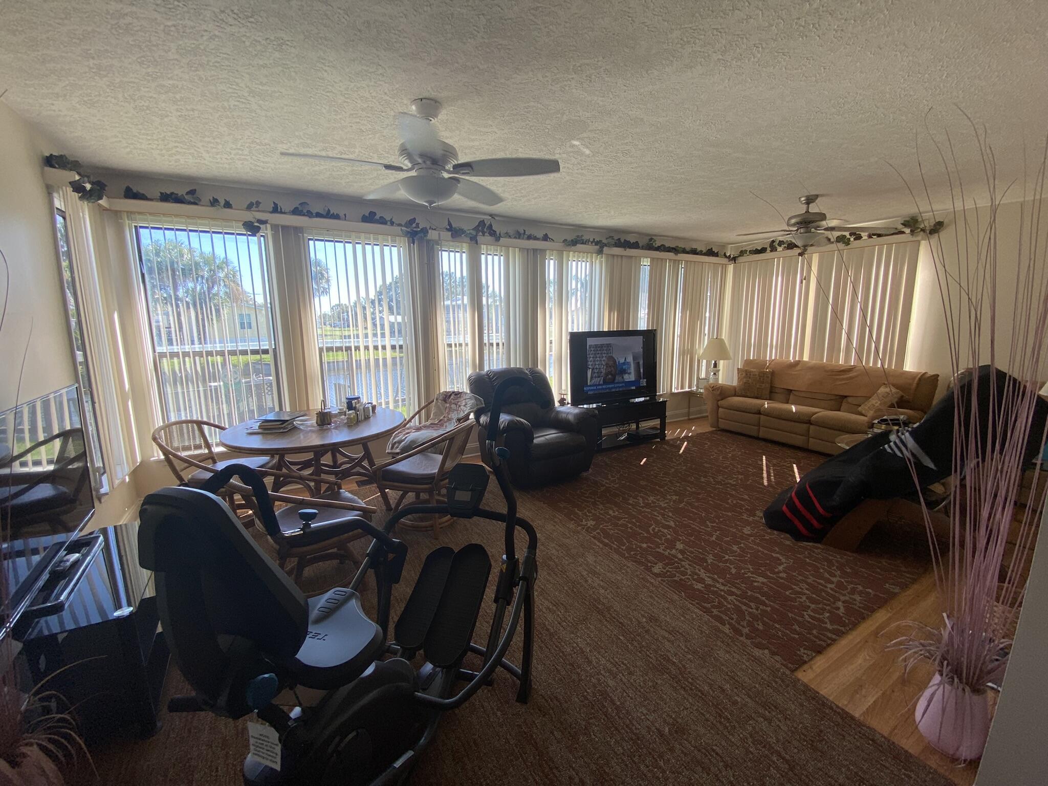 1101 25th Street Okeechobee, FL 34974 - Photo 5 of 28 a view of a livingroom with furniture window and outside view
