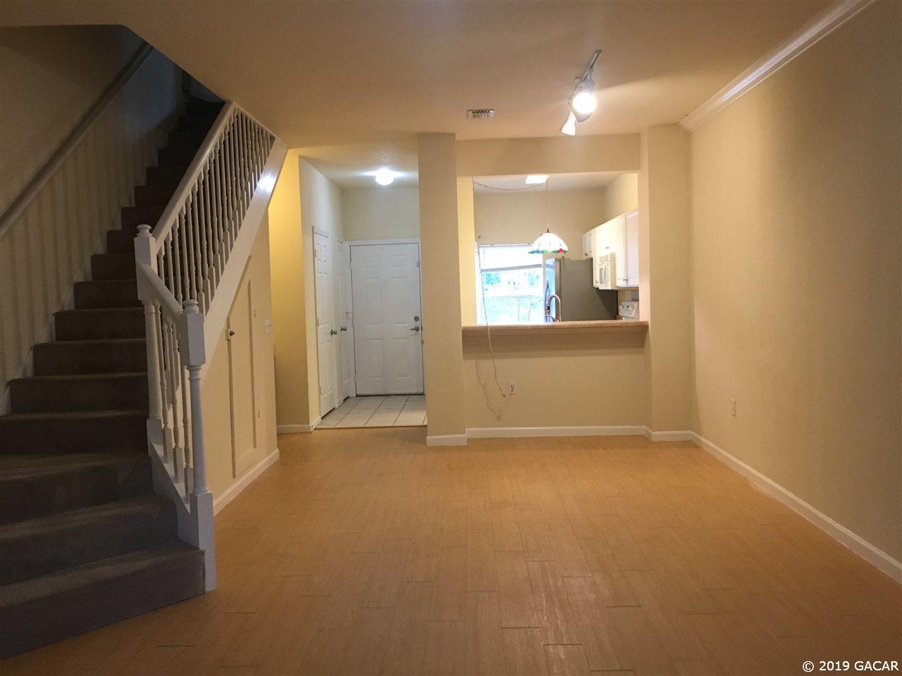 5065 Northwest 45th Road, Unit 106 Gainesville, FL 32606 - Photo 3 of 17 Very open high ceilinged rooms.