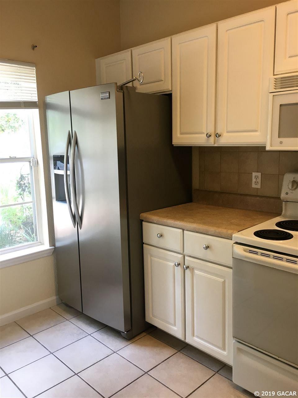 5065 Northwest 45th Road, Unit 106 Gainesville, FL 32606 - Photo 5 of 17 Pantry in kitchen also.