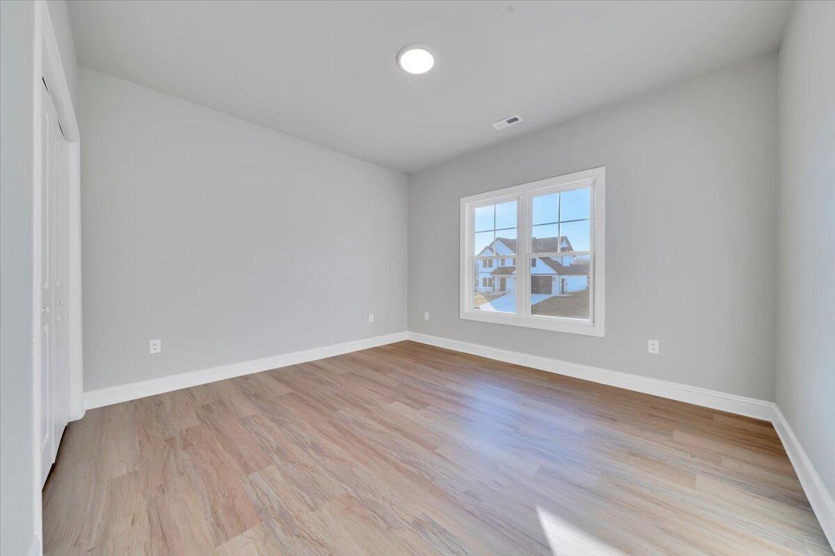 7168 Pkwy Vw Trail Roanoke, VA 24018 - Photo 17 of 26 a view of an empty room with wooden floor and a window