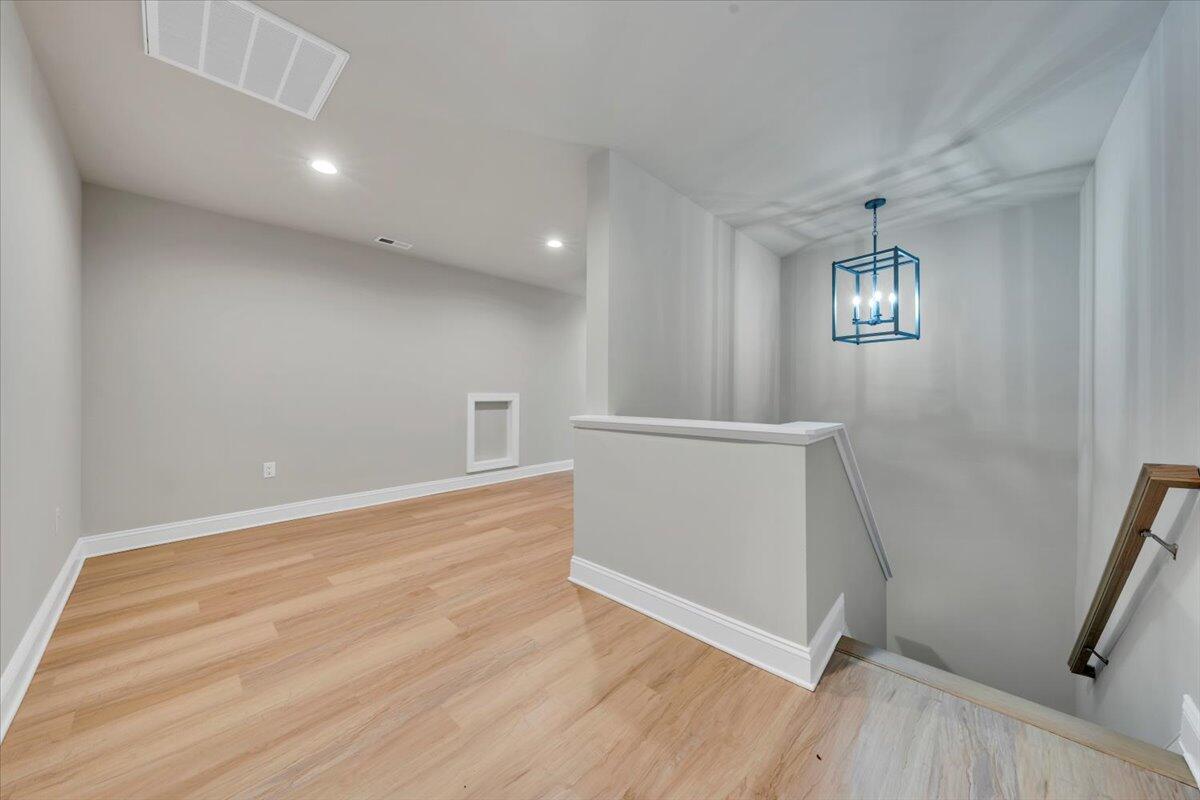 7168 Pkwy Vw Trail Roanoke, VA 24018 - Photo 19 of 26 an empty room with wooden floor and windows