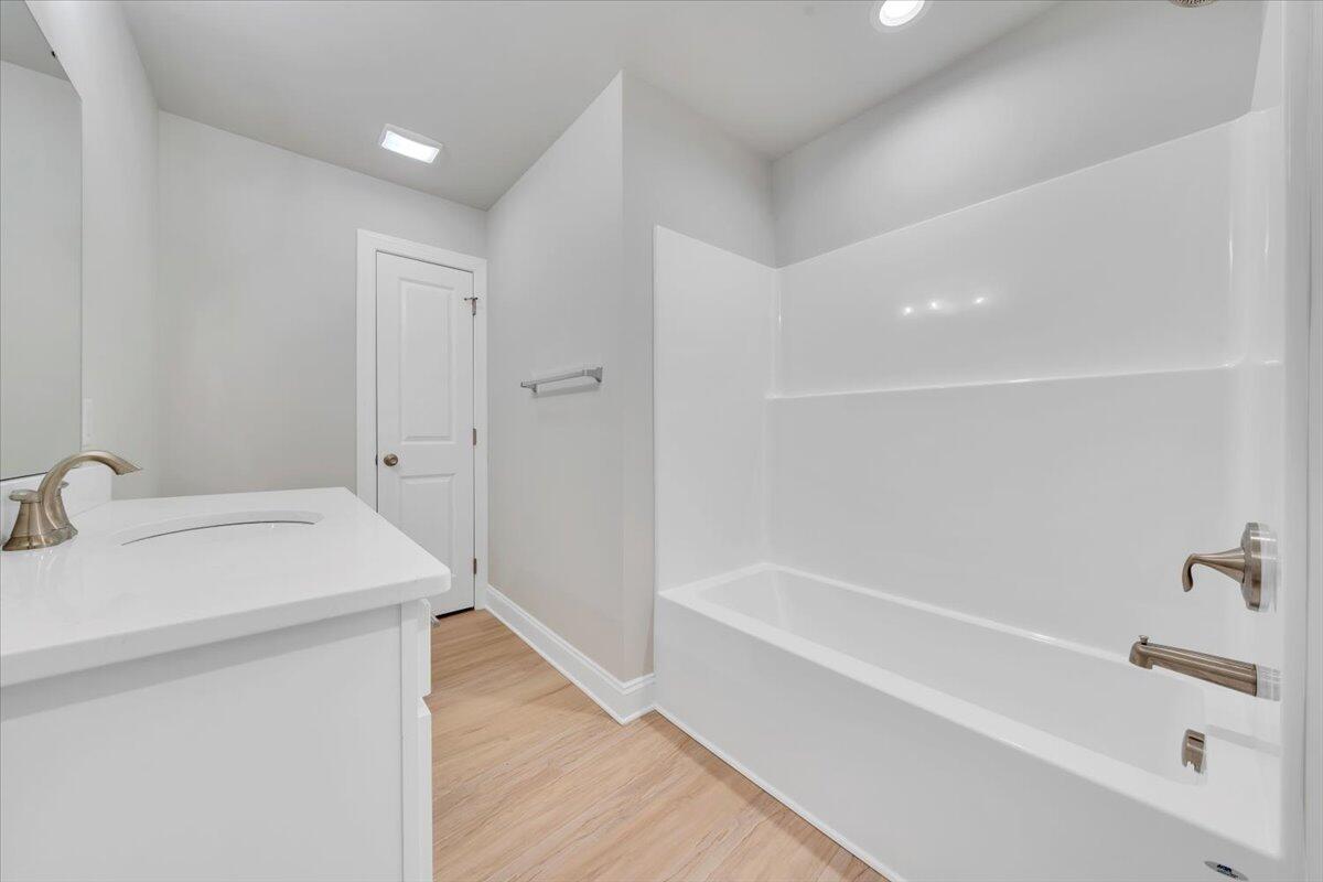 7168 Pkwy Vw Trail Roanoke, VA 24018 - Photo 22 of 26 a bathroom with a bathtub and a sink