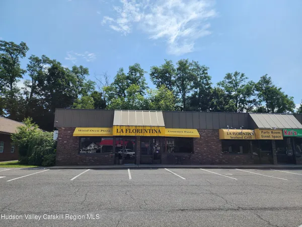 a view of a swimming pool with a yard