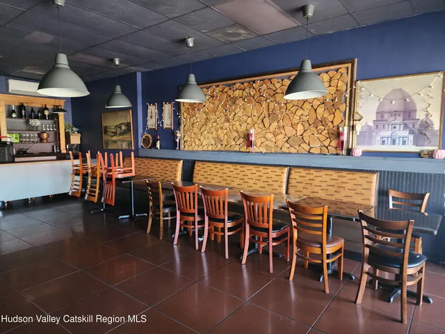 a view of a dining area with furniture window and outside view