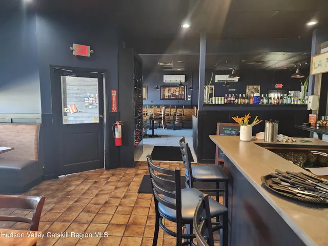 a kitchen with a table and chairs
