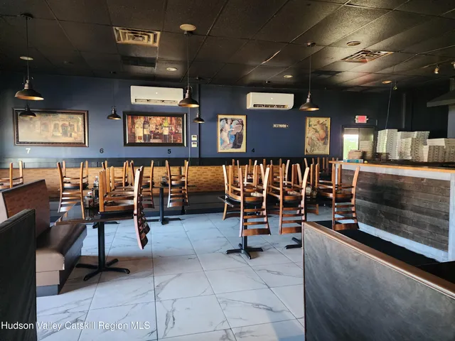 a view of a livingroom with furniture and a flat screen tv