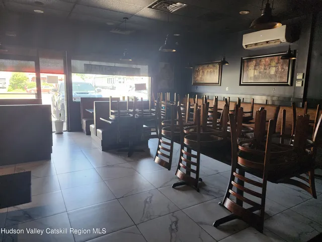 a dining room with furniture and chandelier