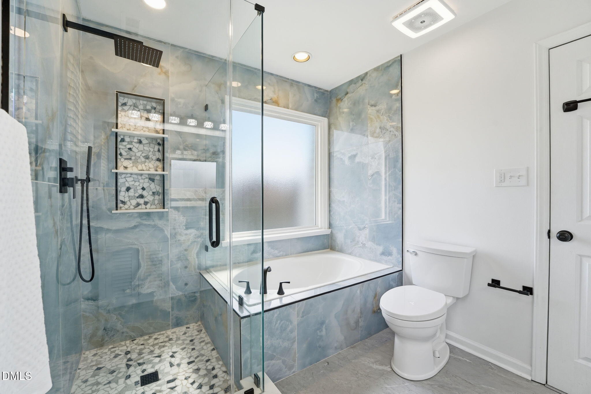 2201 Roswell Road Raleigh, NC 27615 - Photo 20 of 32 a bathroom with a shower and a toilet