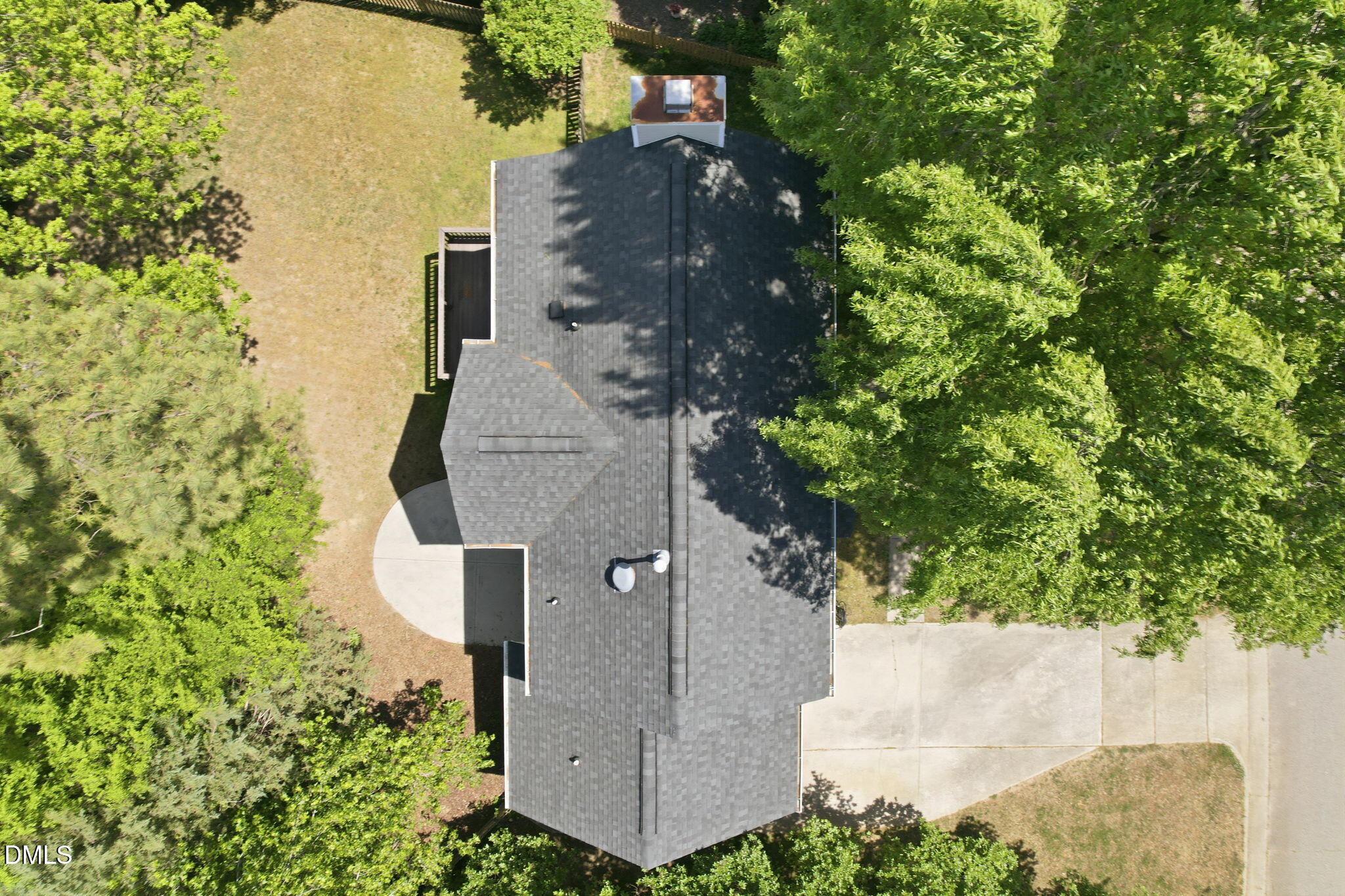 2201 Roswell Road Raleigh, NC 27615 - Photo 2 of 32 an aerial view of a house with a yard and trees