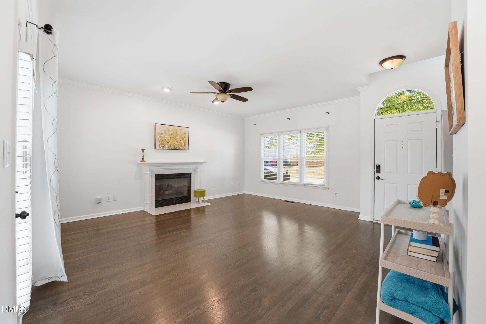 2201 Roswell Road Raleigh, NC 27615 - Photo 3 of 32 a view of an empty room with window and wooden floor