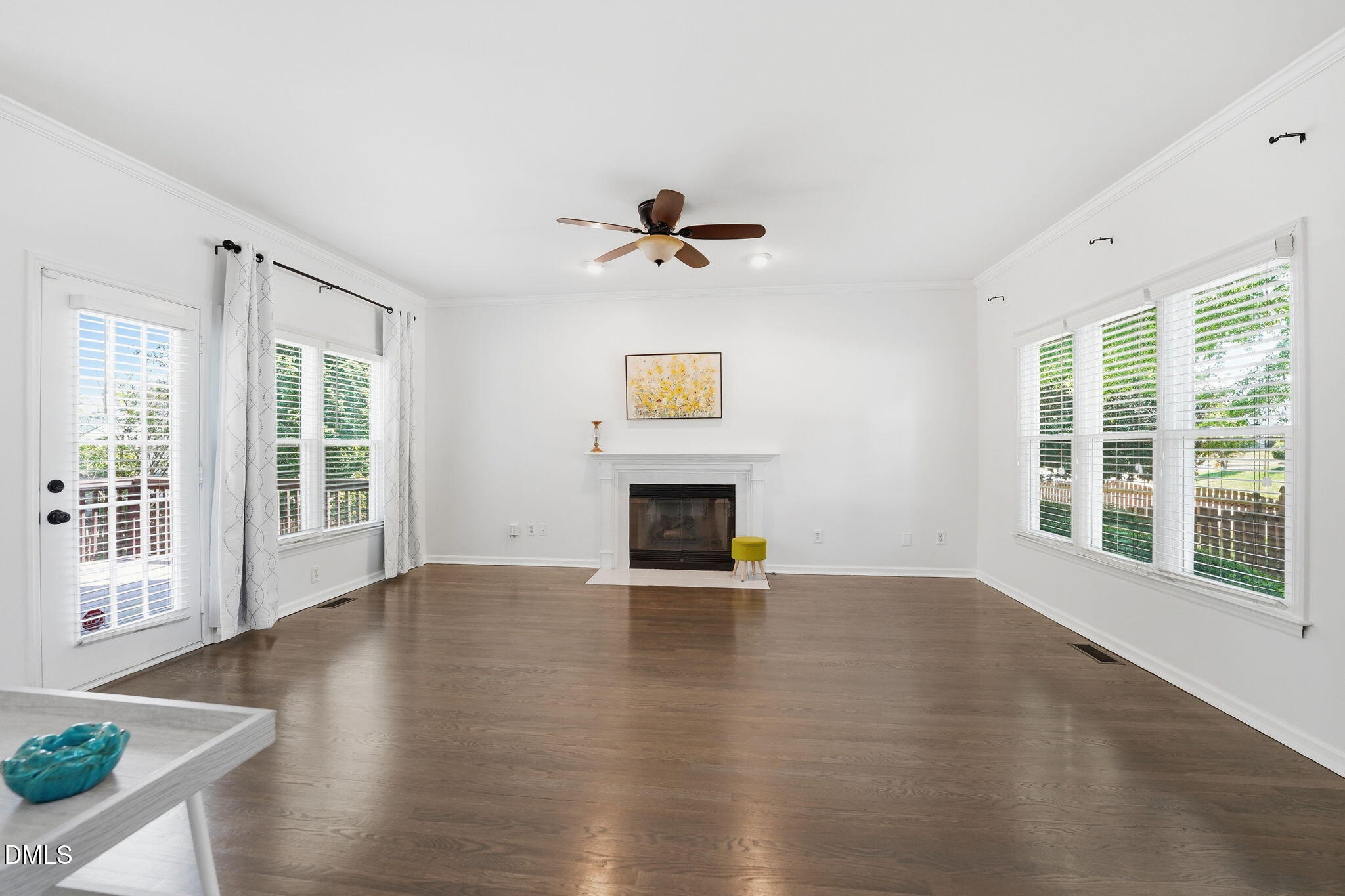 2201 Roswell Road Raleigh, NC 27615 - Photo 4 of 32 a view of an empty room with a window and fireplace