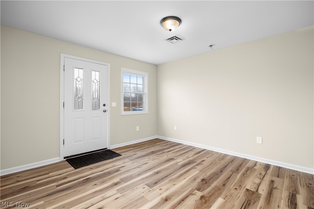 12452 Island Road Grafton, OH 44044 - Photo 6 of 39 Entrance foyer with light wood finished floors and baseboards