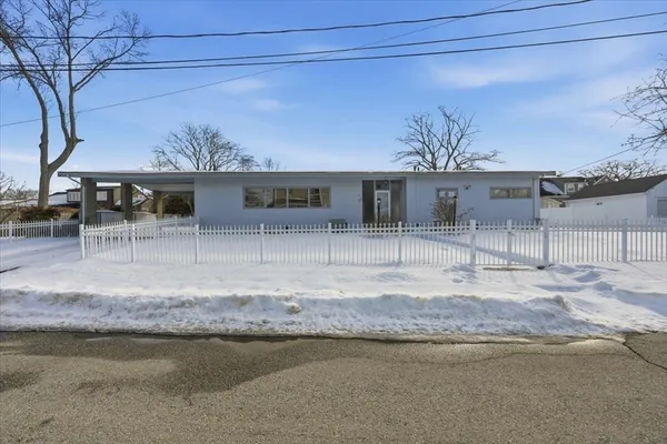 a front view of a house with swimming pool