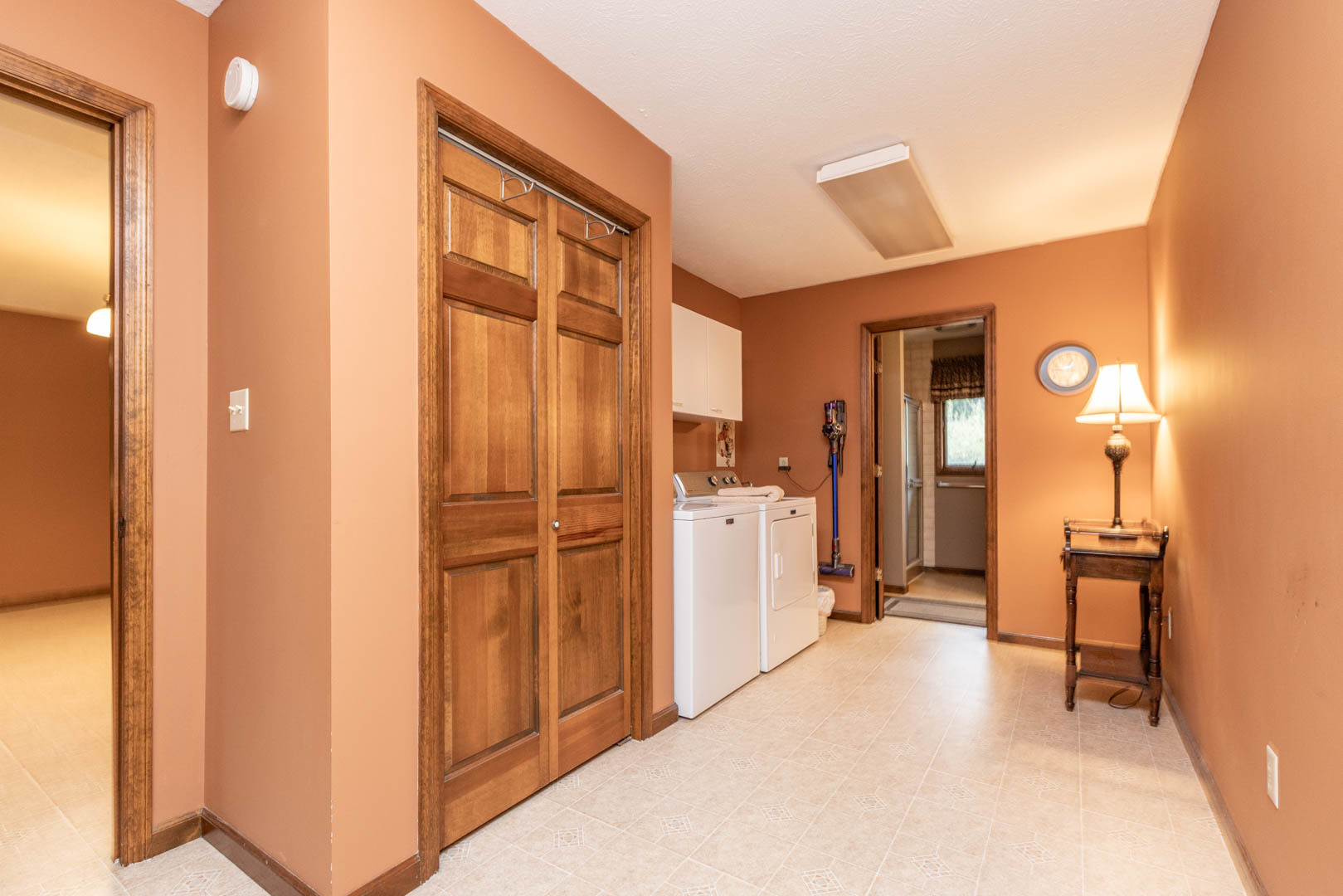 19051 Meander Way Bloomington, IL 61705 - Photo 13 of 30 a view of a bathroom with a shower and a mirror