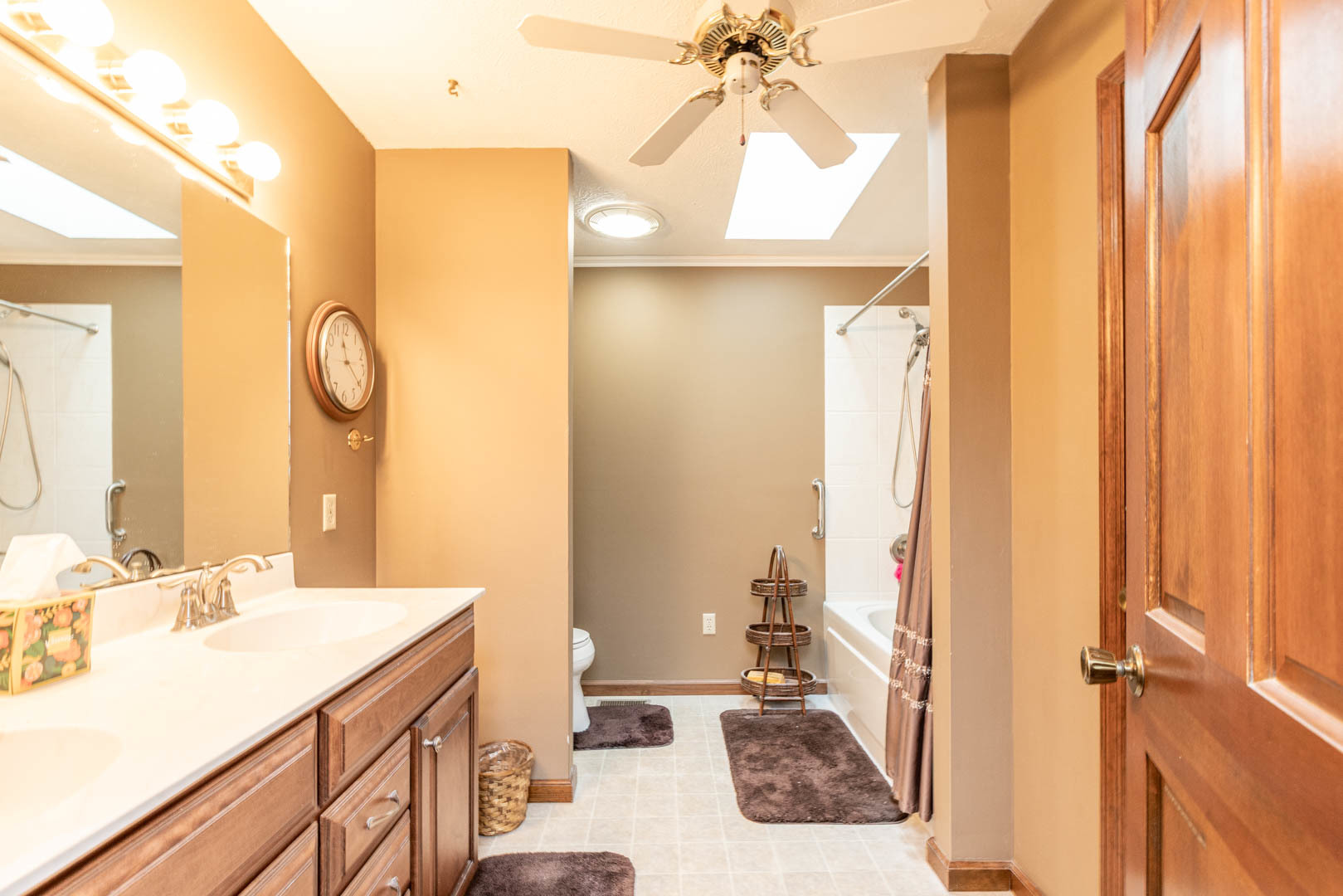19051 Meander Way Bloomington, IL 61705 - Photo 21 of 30 a bathroom with a sink a mirror and a shower