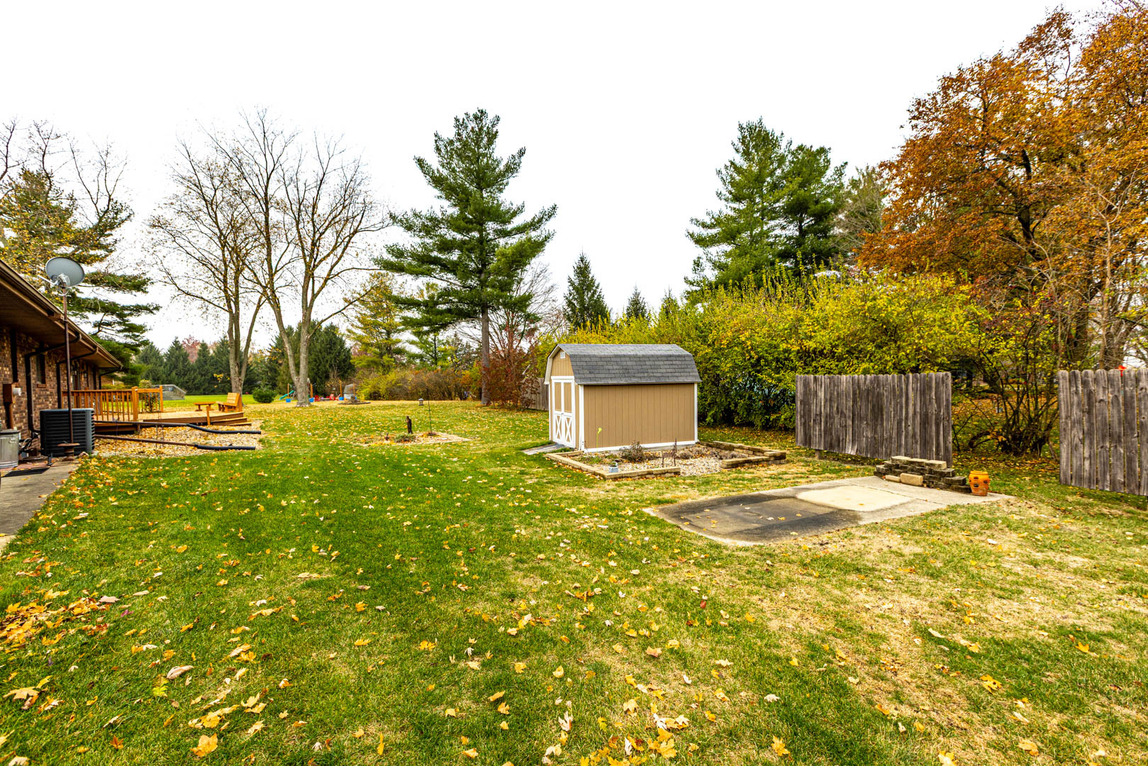19051 Meander Way Bloomington, IL 61705 - Photo 26 of 30 a big yellow house with trees in front of it