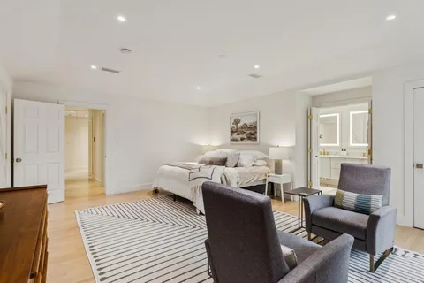 a living room with furniture and a rug