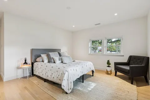 a bedroom with a bed and a couch