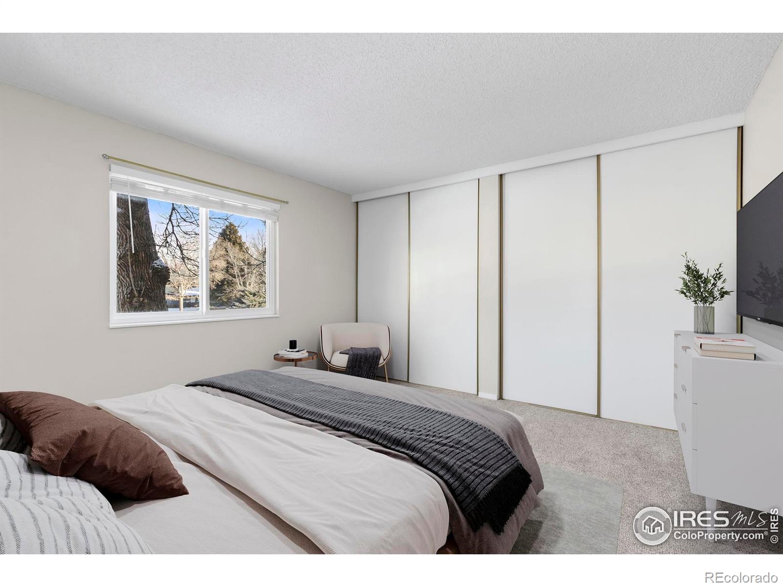 925 Columbia Road Fort Collins, CO 80525 - Photo 12 of 24 a bedroom with a large bed and a window