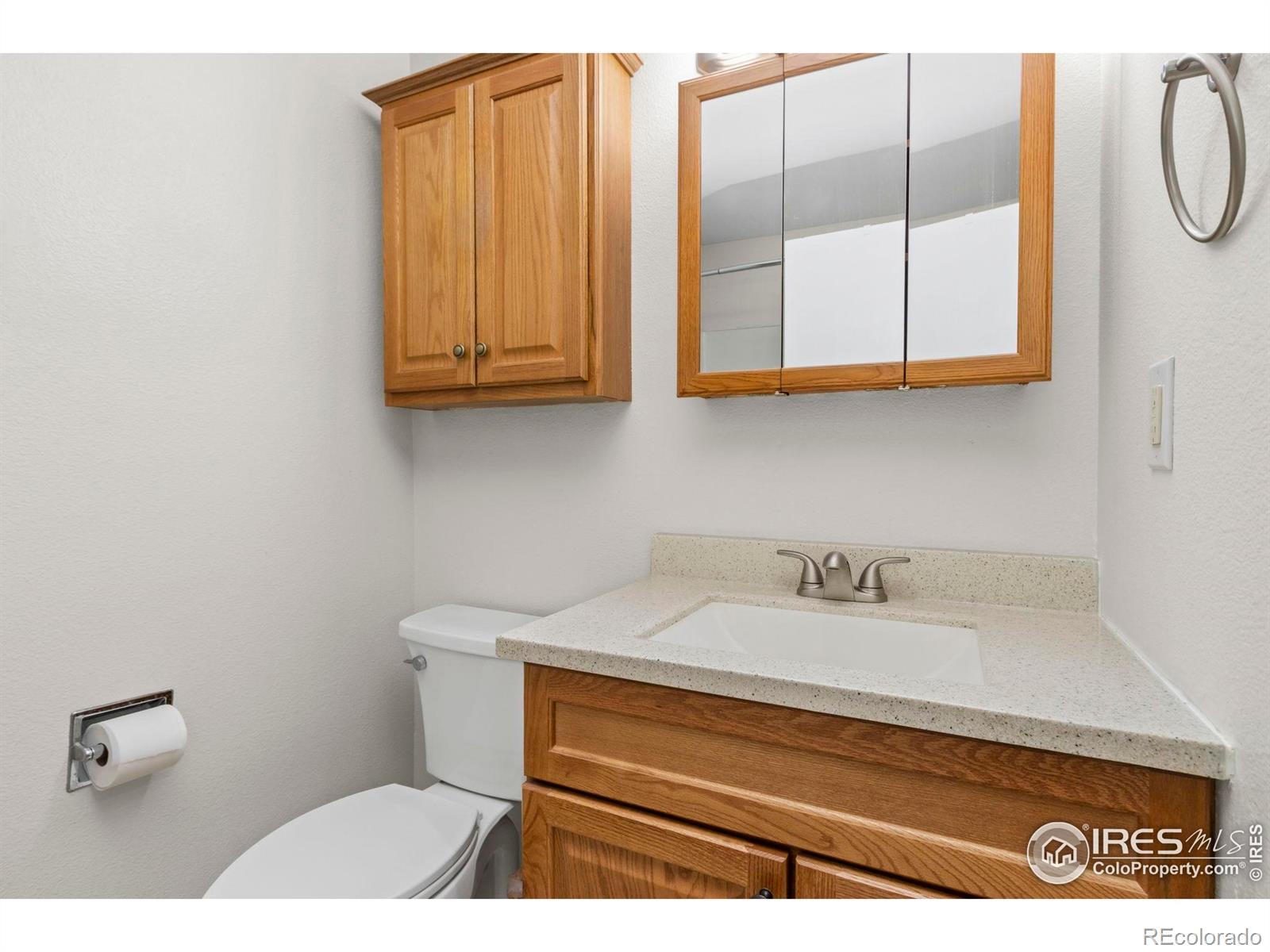 925 Columbia Road Fort Collins, CO 80525 - Photo 16 of 24 a bathroom with a sink and a mirror