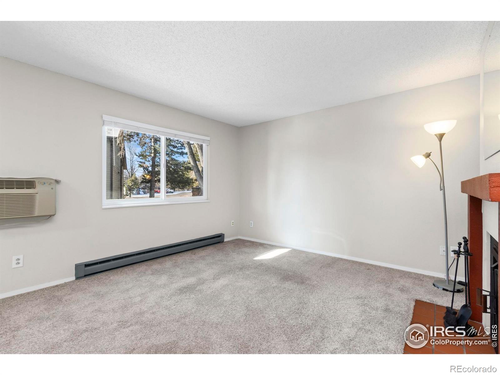 925 Columbia Road Fort Collins, CO 80525 - Photo 6 of 24 a view of an empty room with a window