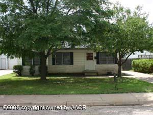 4010 Crockett Street Amarillo, TX 79110 - Photo 1 of 1 a front view of a house with a yard