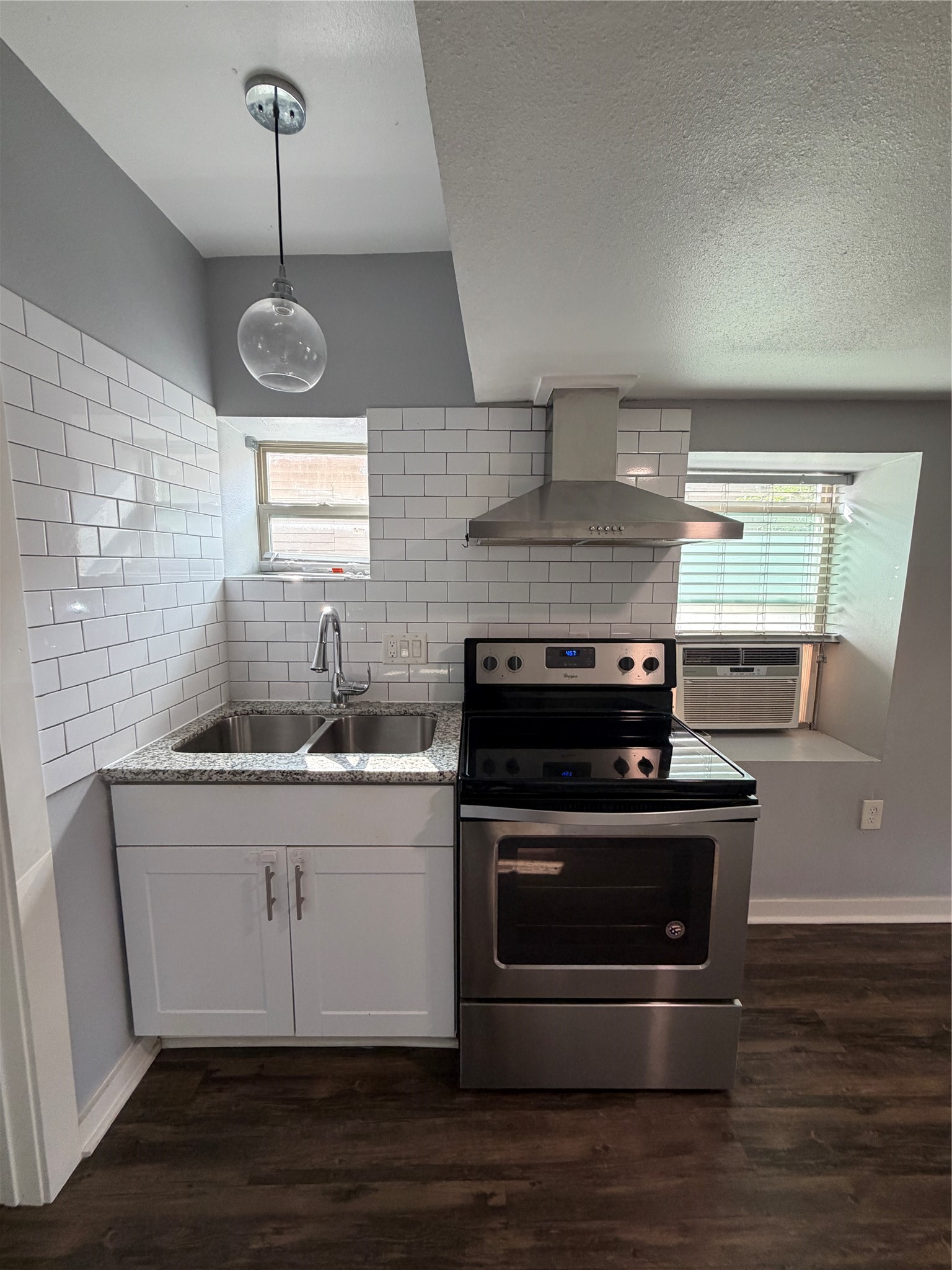 4630 Woodside Street, Unit 2 Houston, TX 77023 - Photo 1 of 11 a kitchen with a stove and a sink