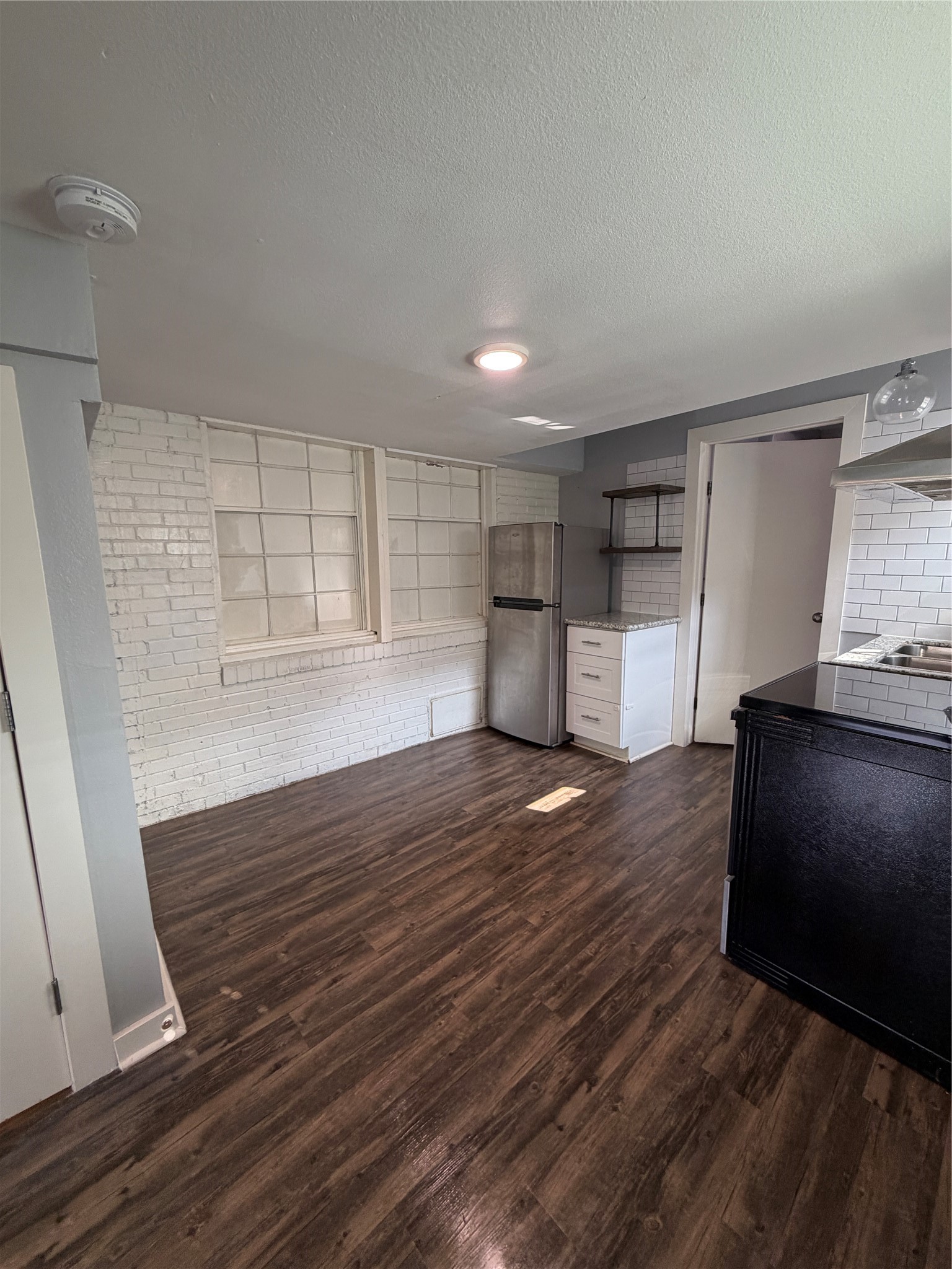 4630 Woodside Street, Unit 2 Houston, TX 77023 - Photo 3 of 11 a view of empty room with wooden floor