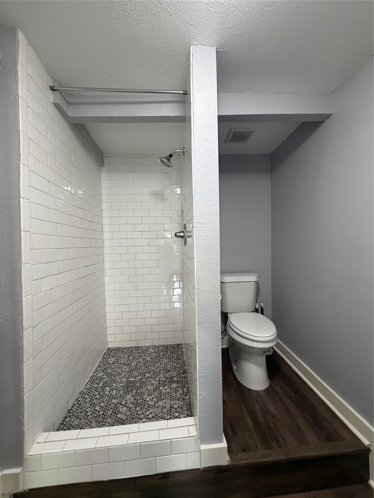 4630 Woodside Street, Unit 2 Houston, TX 77023 - Photo 5 of 11 a bathroom with a toilet and a shower