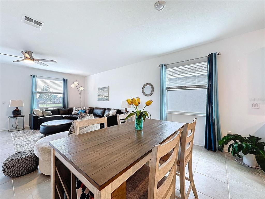 4190 Bull Street St. Cloud, FL 34772 - Photo 28 of 98 a dining room with furniture and wooden floor