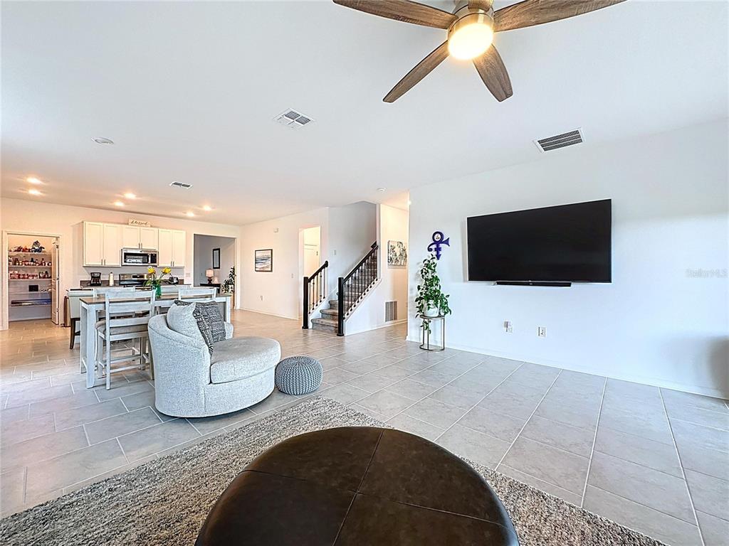 4190 Bull Street St. Cloud, FL 34772 - Photo 34 of 98 a living room with furniture and a flat screen tv