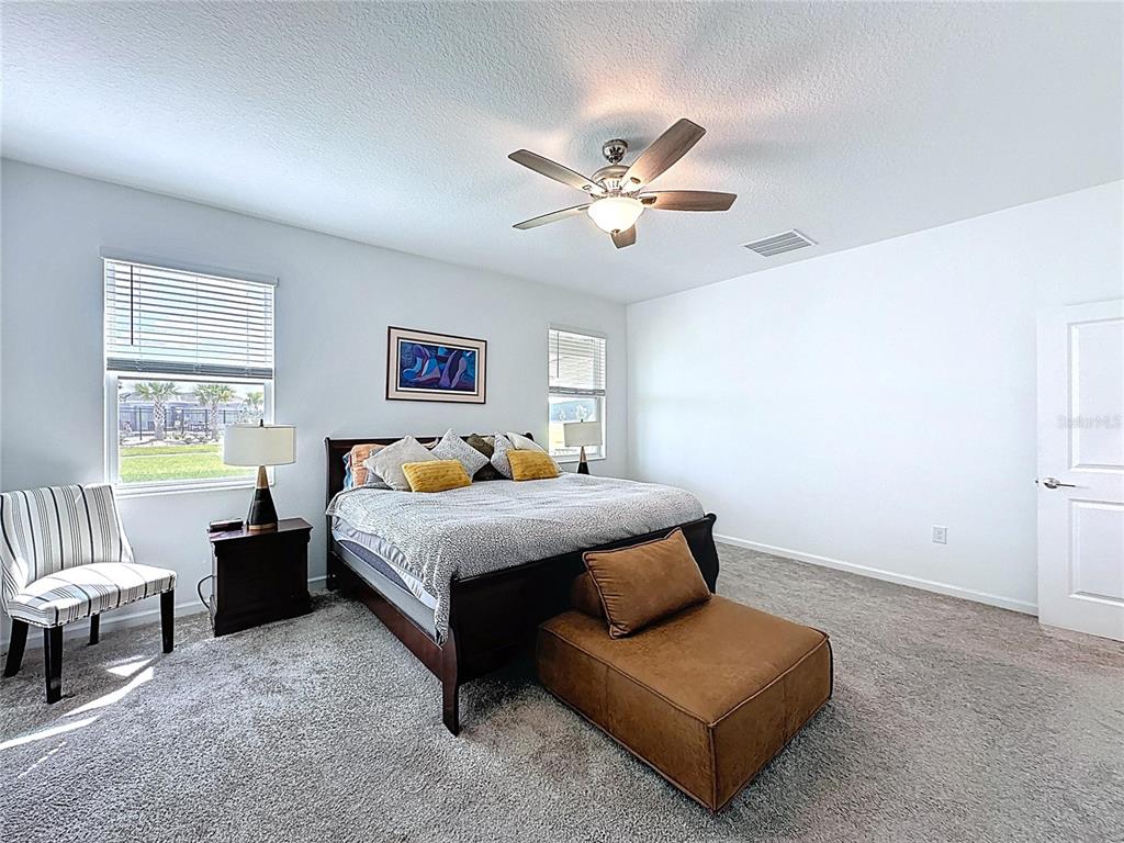 4190 Bull Street St. Cloud, FL 34772 - Photo 38 of 98 a bedroom with furniture and a large window