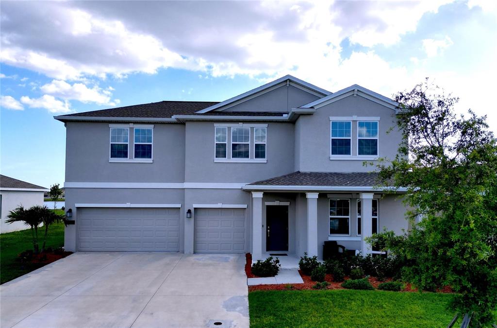 4190 Bull Street St. Cloud, FL 34772 - Photo 5 of 98 front view of a house with a yard