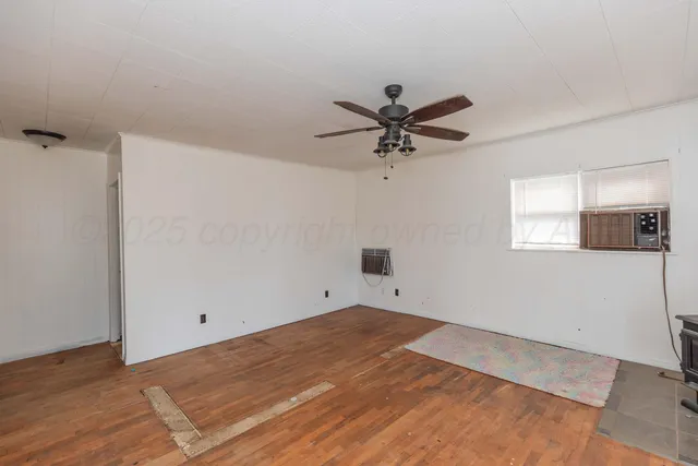 a view of an empty room with a bathroom