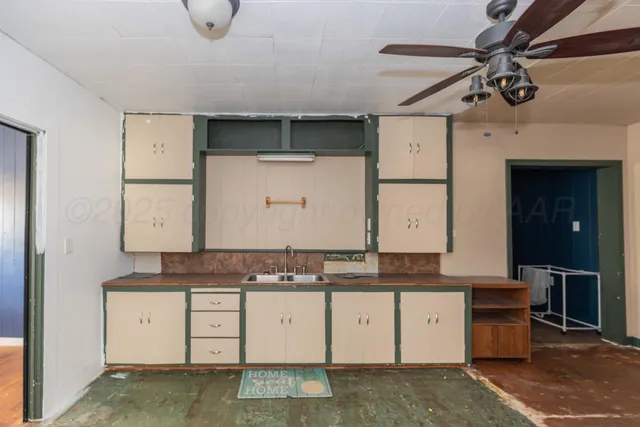 a bathroom with a granite countertop sink a mirror and a vanity