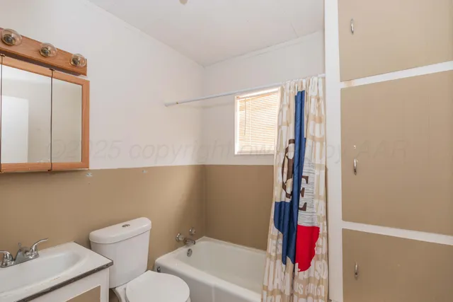 a bathroom with a toilet and a sink