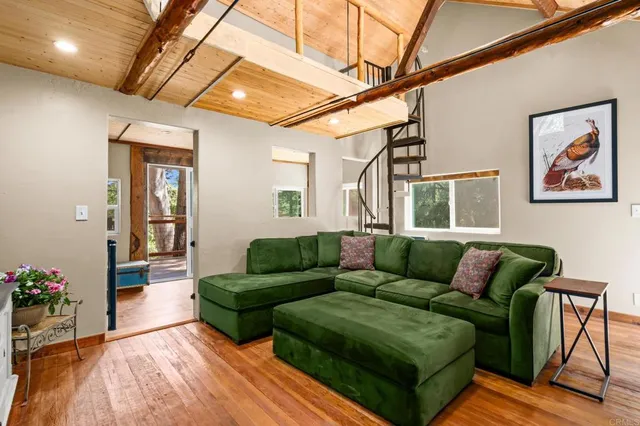 a balcony view with sitting space and wooden floor